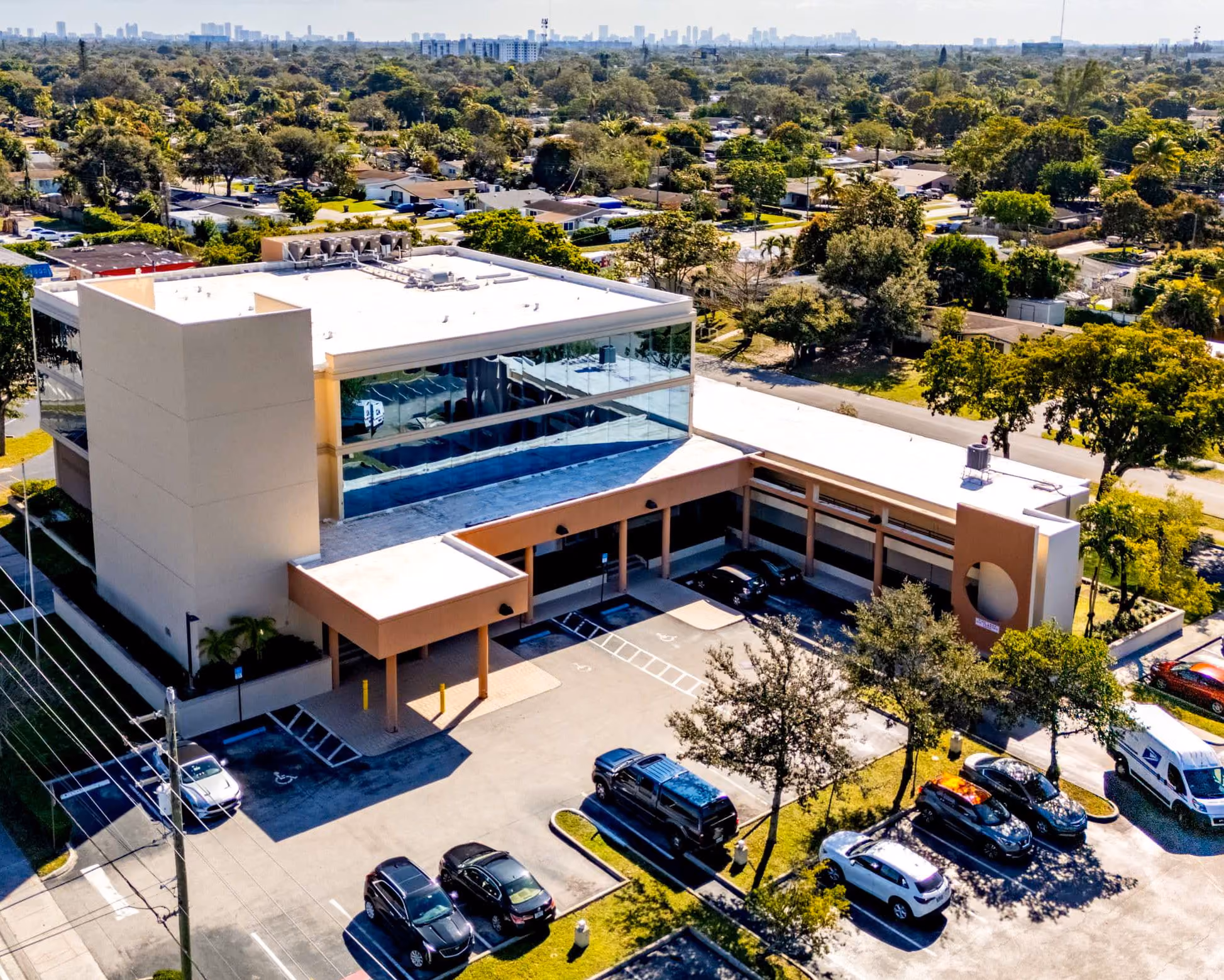 An aerial view of the office building and its glazed atrium from above Taft Street.